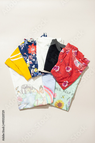 A pile of girl clothes with various pattern
