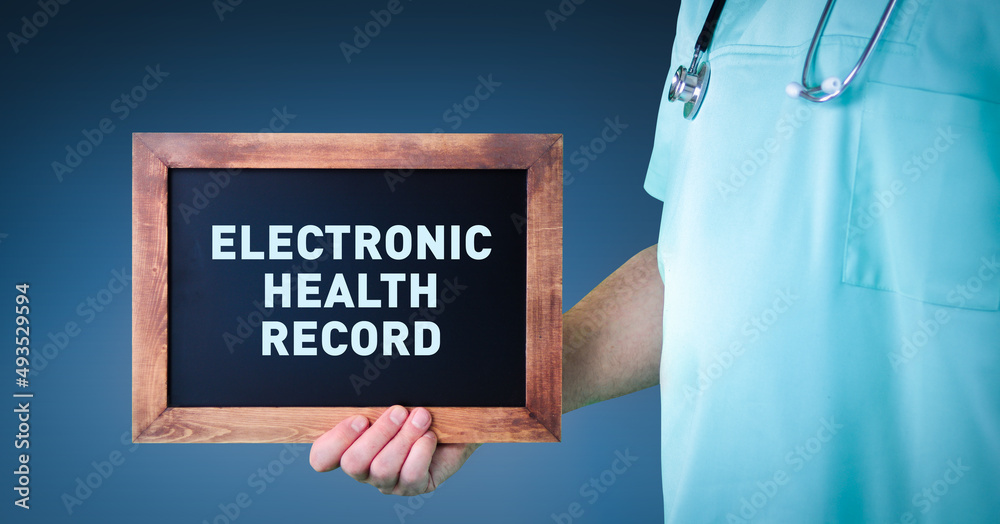 Electronic health record (EHR). Doctor shows sign/board with wooden frame. Background blue Electronic health record (EHR). Doctor shows sign/board with wooden frame. Background blue