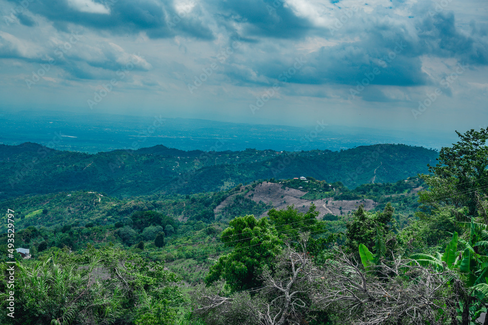 Obraz premium Mountains view before raining. Exotic panorama on rain woodland