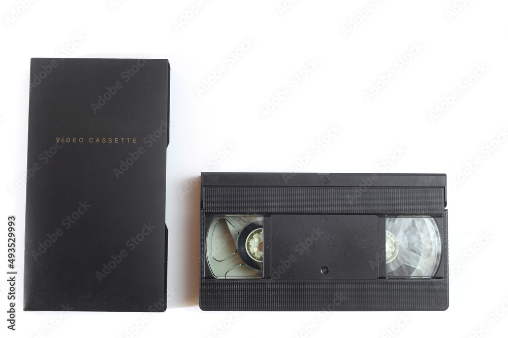 Black VHS video tape cassette with blank label isolated on white background