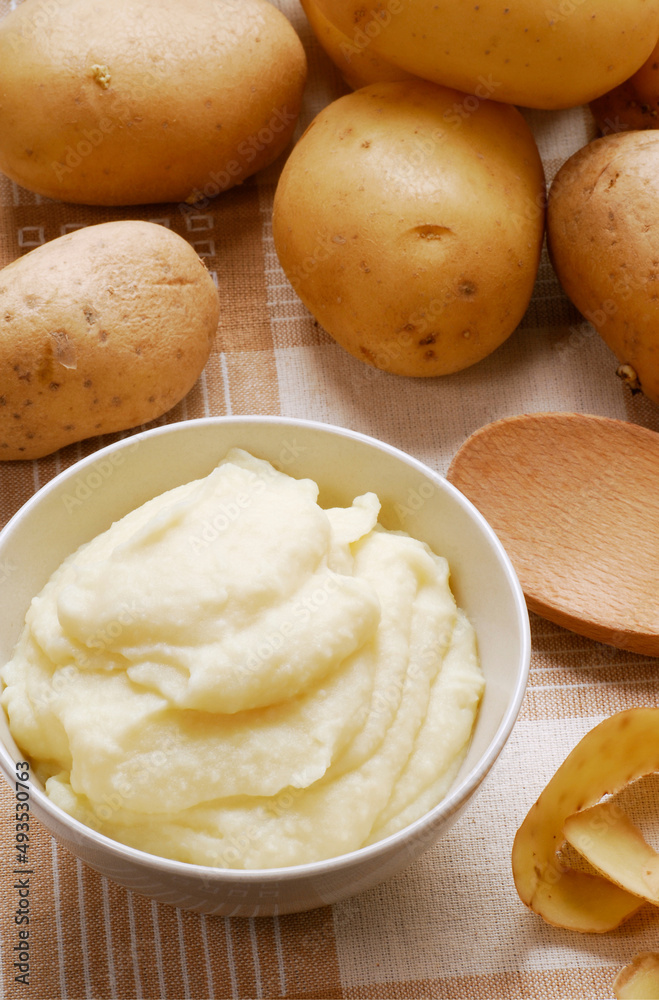 Fresh potato puree on potatoes background. Fresh potato puree on potatoes background.