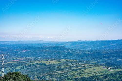 Mountains panorama look. Pick view on forest land