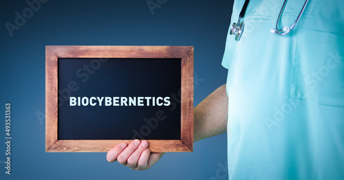 Biocybernetics. Doctor shows sign/board with wooden frame. Background blue photo