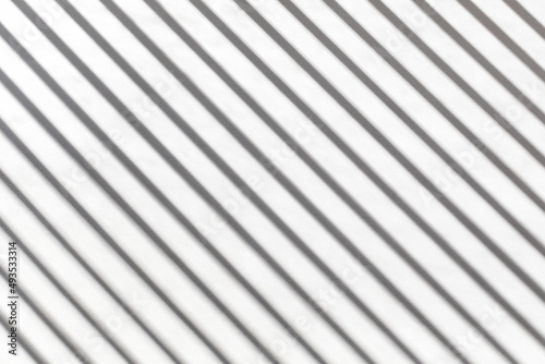 On a white background, the shadow of slanted parallel lines, the idea of a backdrop
