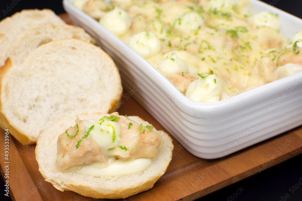 Chicken slices with cream cheese in a bread close Chicken slices with cream cheese in a bread close