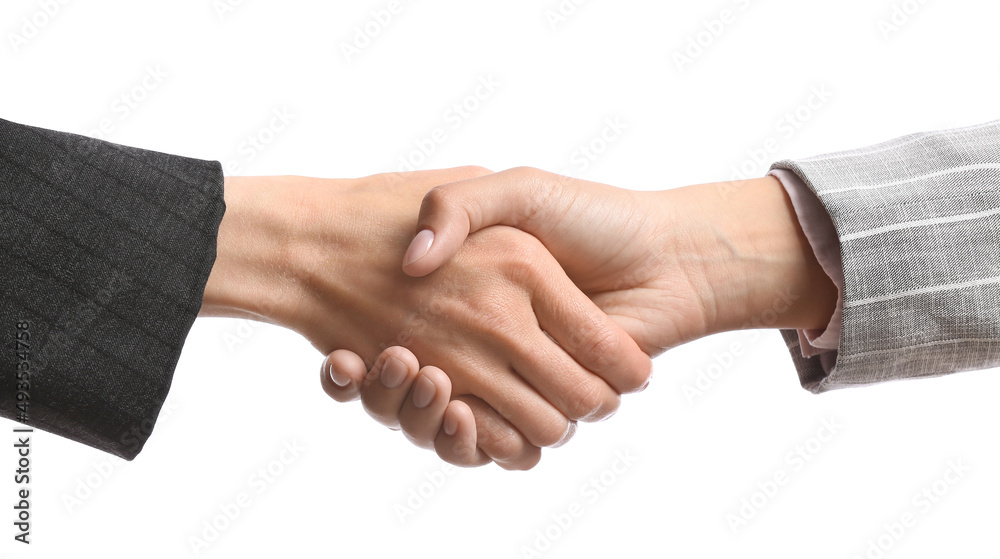 Businesswomen shaking hands on white background Businesswomen shaking hands on white background