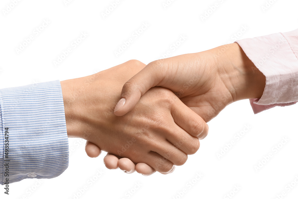 Businesswomen shaking hands on white background Businesswomen shaking hands on white background