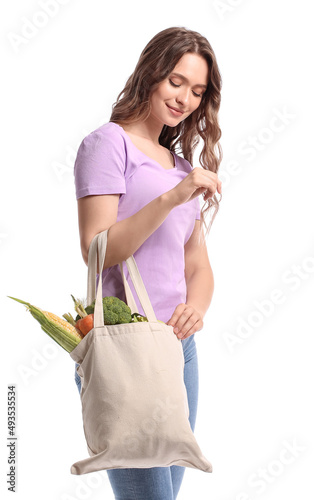 Young woman holding eco bag...