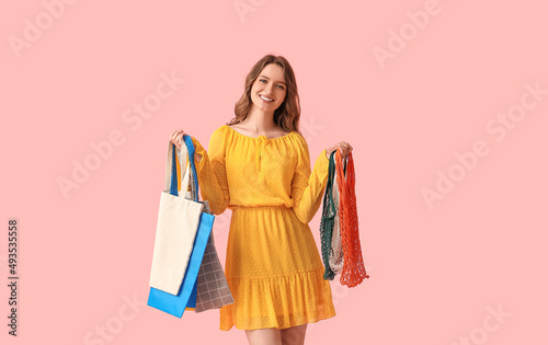Pretty young woman with eco...
