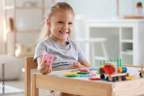 Cute little girl playing wi...