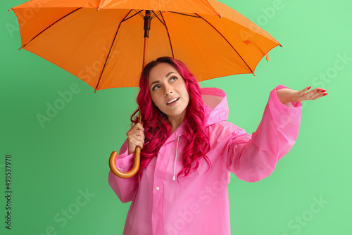 Beautiful woman in raincoat...