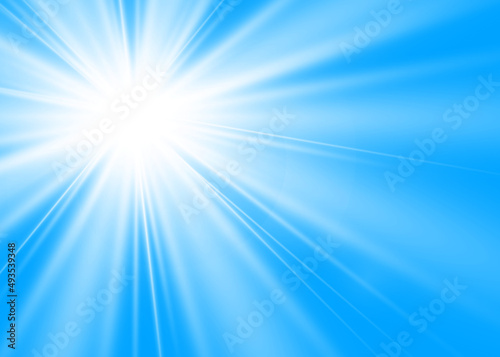 Natural sun glare on a blue background.Sunlight.Glowing isolated white transparent light effect, glare.