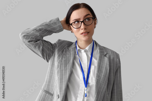 Worried young businesswoman...