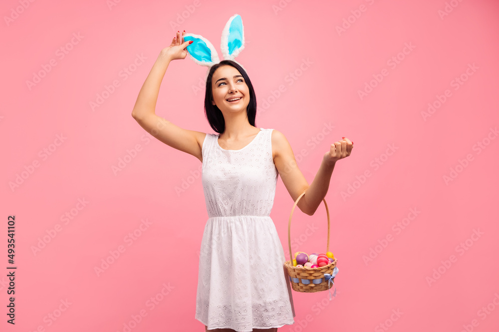 beautiful woman in rabbit ears with a basket of Easter eggs, on the Easter holiday beautiful woman in rabbit ears with a basket of Easter eggs, on the Easter holiday