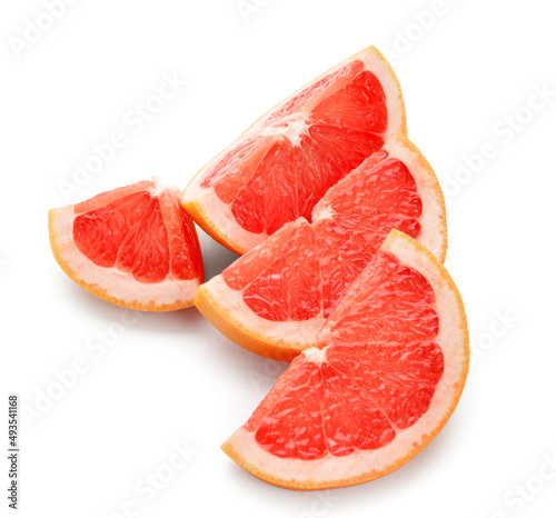 Pieces of tasty ripe grapefruit on white background