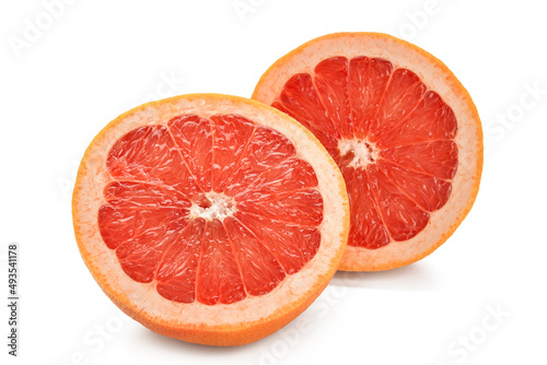 Halves of tasty ripe grapefruit on white background