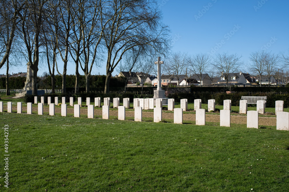 Le Mans, France - February 27, 2022: The west cemetery in Le Mans contains Belgium, French,American, Polish, Commonwealth and German graves.  Sunny winter day. Selective focus.