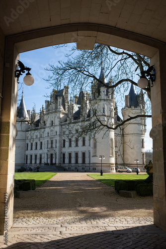 Challain-la-Potherie, France - February 28, 2022: The Castel of Challain la Potherie is a 19th-century castle in the Pays de la Loire. Sunny winter day. Selective focus. photo