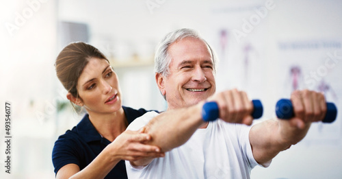 Hes as healthy as a horse. Shot of an attractive young female physiotherapist working with a senior male patient. © Sean A E/peopleimages.com