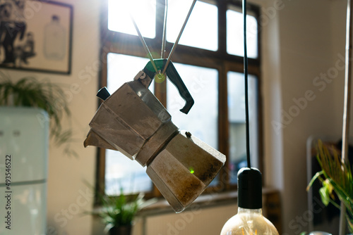 hanging Moka pot on in a loft kitchen with beautiful light