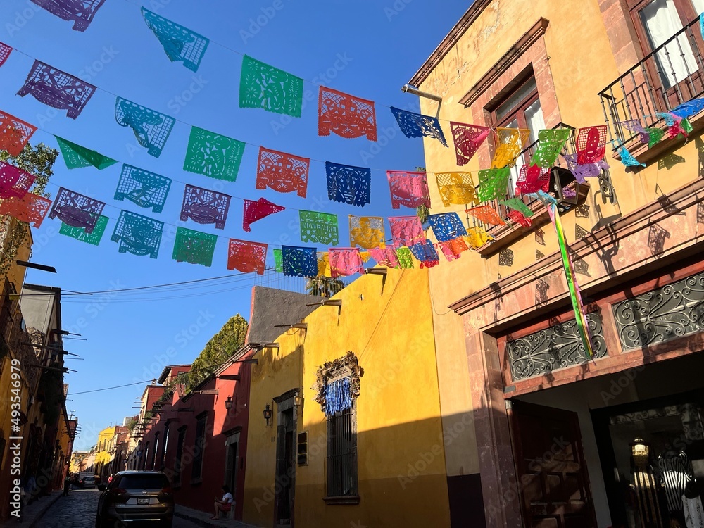 Fototapeta premium San Miguel de Allende Street - Traditional Mexican Town - Historic City Buildings - Scenic Narrow Streets - Travel Pictures - Empty Cobblestone Road - Papel Picado