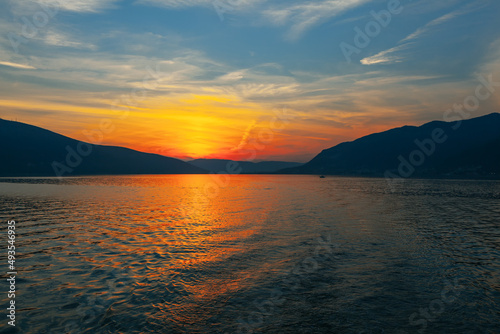 Spectacular sunset over the sea . Fantastic twilight with mountains and sea 