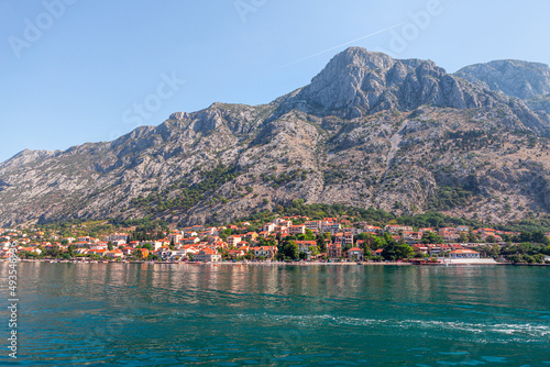 Coastal town with resorts . Kotor Montenegro scenery . Houses on the seaside 