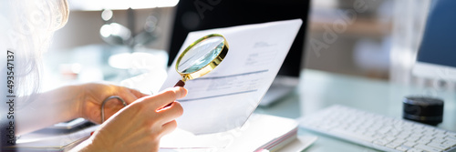 Canvas Print Lawyer Examining Paper Using Magnifier Glass