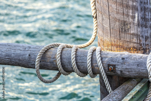 Konstfotografi A hawser rope around a wooden post at a landing stage