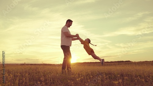 happy father husband spin child kid air. childhood dream fly. little child superhero flies playing with dad. happy family weekend vacation park. holiday journey laughing child daughter. mood happiness