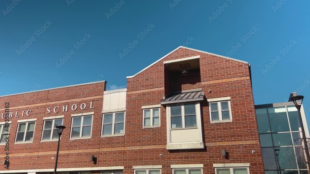 Public School exterior establishing shot camera pan across. Public School exterior establishing shot camera pan across.