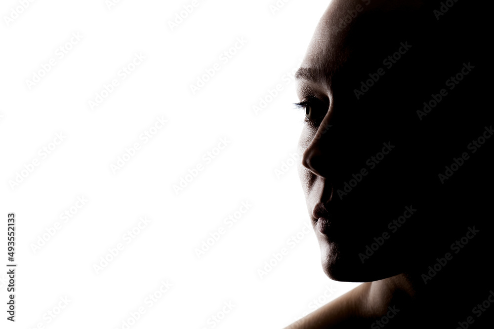 dark studio portrait of a beautiful young woman against white backgroung