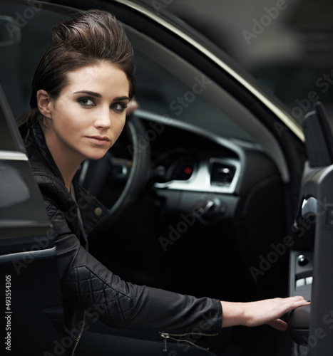 Stylish chic in her luxury car. A gorgeous leather-clad woman sitting in her luxury vehicle. © Alexandra/peopleimages.com