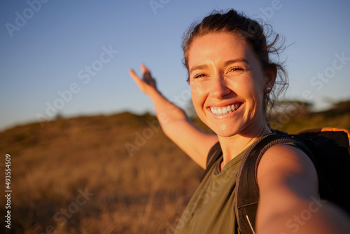 I want to share my journey with everyone. Shot of a young woman taking a selfie while out hiking.
