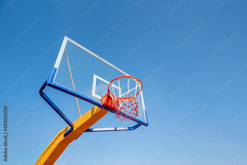 A basketball box under the blue sky