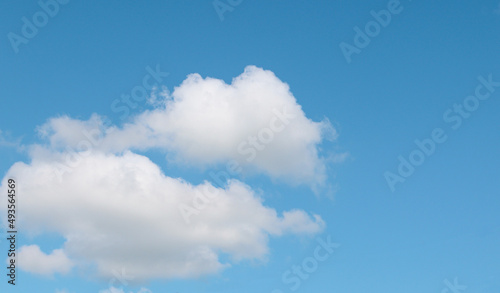 Blue sky with a thin white cloud