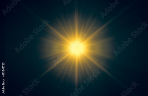 Abstract orange sparkling light rays and lighting flare on dark blue sky background.