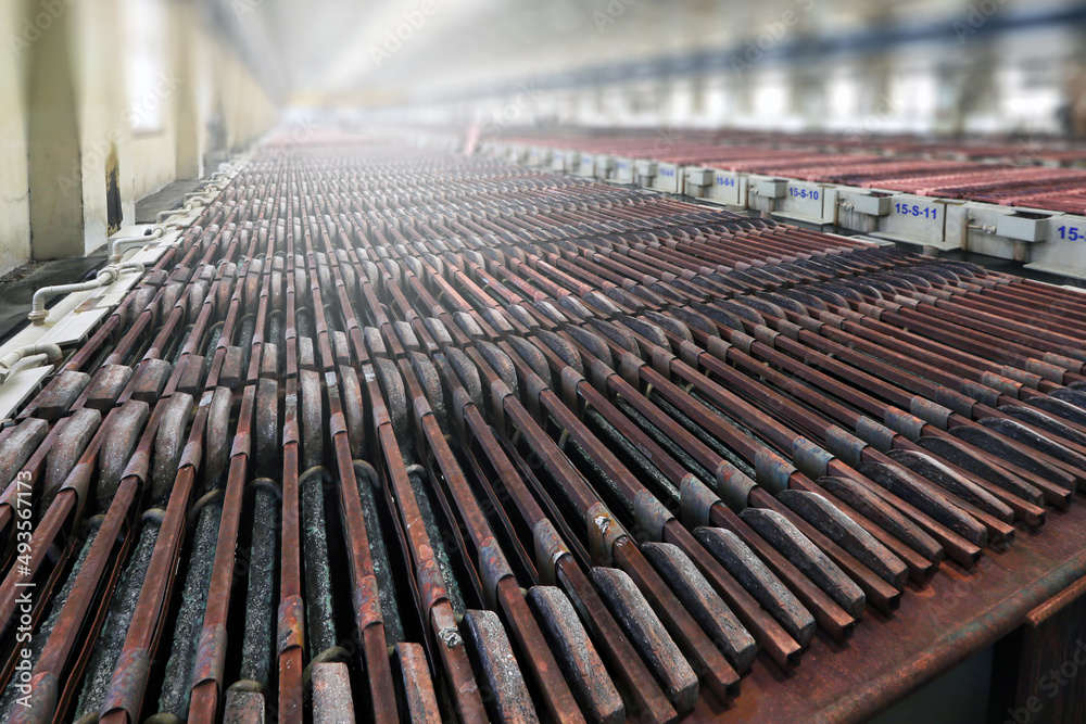 Electrolysis of copper anodes and cathodes. Copper is refined by