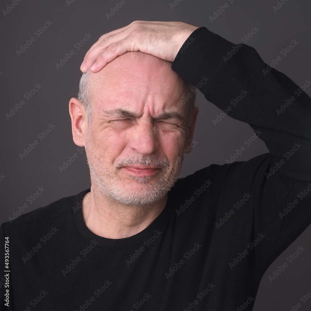 Obraz premium man with closed eyes emotion of pain on his face