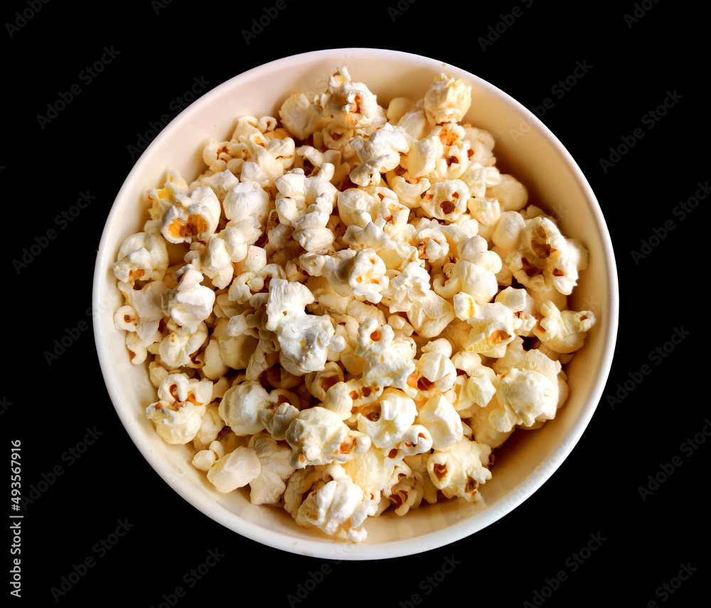 bowl of popcorn isolated, popcorn in a bowl on black background. bowl of popcorn isolated, popcorn in a bowl on black background.