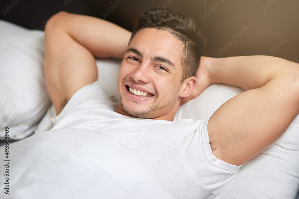 My bedroom is my favorite place. Cropped shot of a handsome young man lying in bed. My bedroom is my favorite place. Cropped shot of a handsome young man lying in bed.