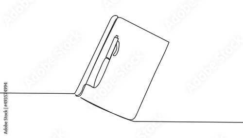 Single continuous line drawing of notebook with a pen above work desk