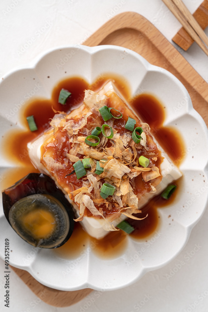 Delicious Chilled tofu and century egg with soy sauce and bonito flakes. Delicious Chilled tofu and century egg with soy sauce and bonito flakes.
