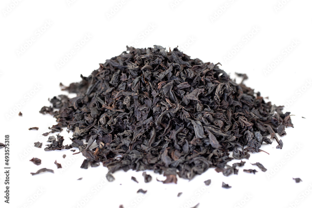 Dry black tea grains isolated on white background. Dry black tea grains isolated on white background.