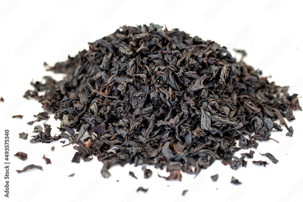 Dry black tea grains isolated on white background. Dry black tea grains isolated on white background.