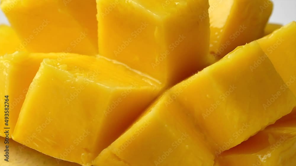 Rotation of rip mango slice cubes cut, Mango half cut in cubes, Fresh juicy mango fruit Rotation of rip mango slice cubes cut, Mango half cut in cubes, Fresh juicy mango fruit