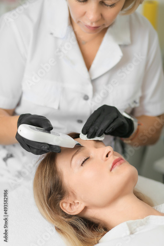 Electroporation procedure close-up. Girl on a cosmetic procedure