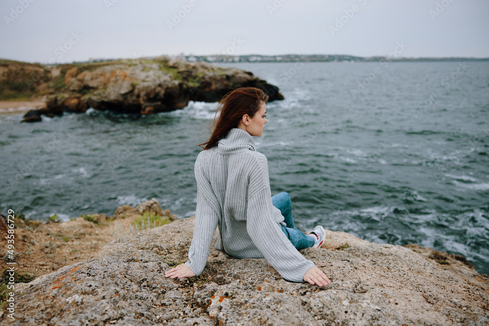 woman sweaters cloudy sea admiring nature Lifestyle