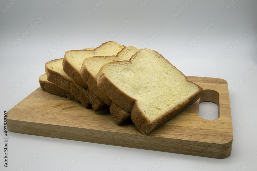 Butter bread on a wooden tray, white background, Include Clipping Path.