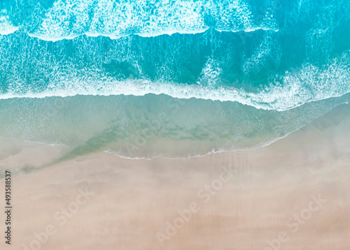 Aerial top view of the beach wave on tropical sea in summer background